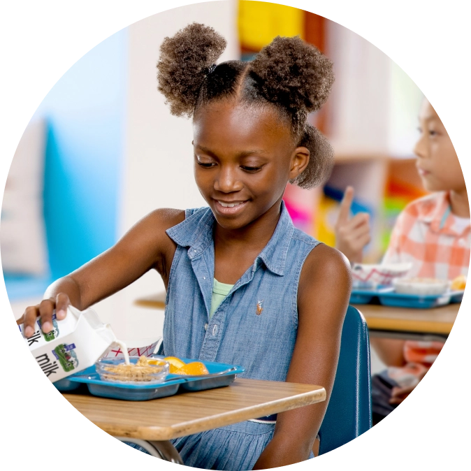 Girl eating lunch in class