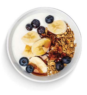 Yogurt parfait topped with fruit and granola