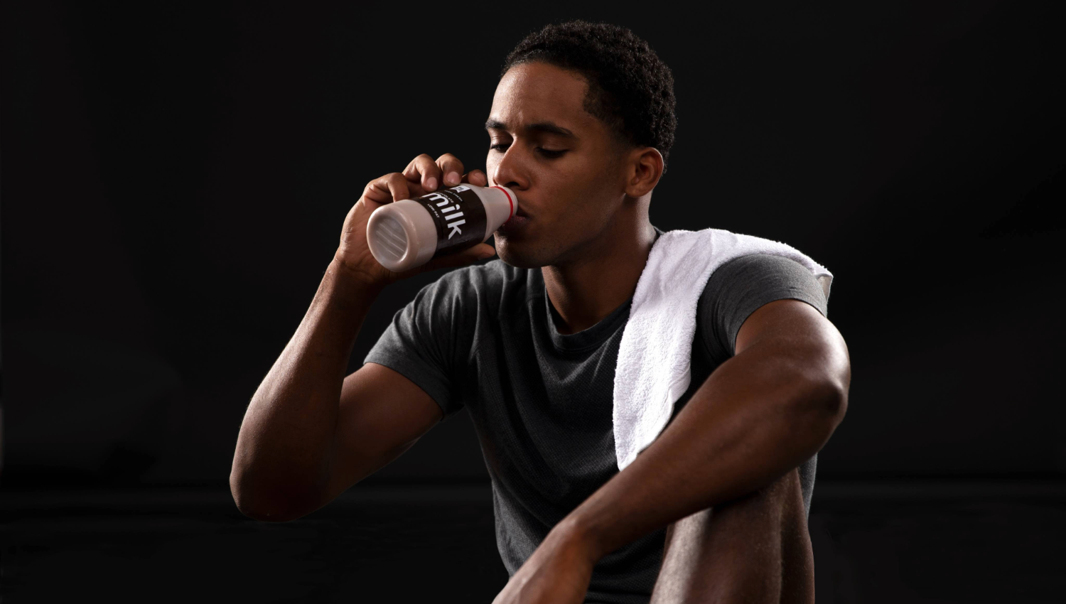 Athlete recovers with chocolate milk after a workout