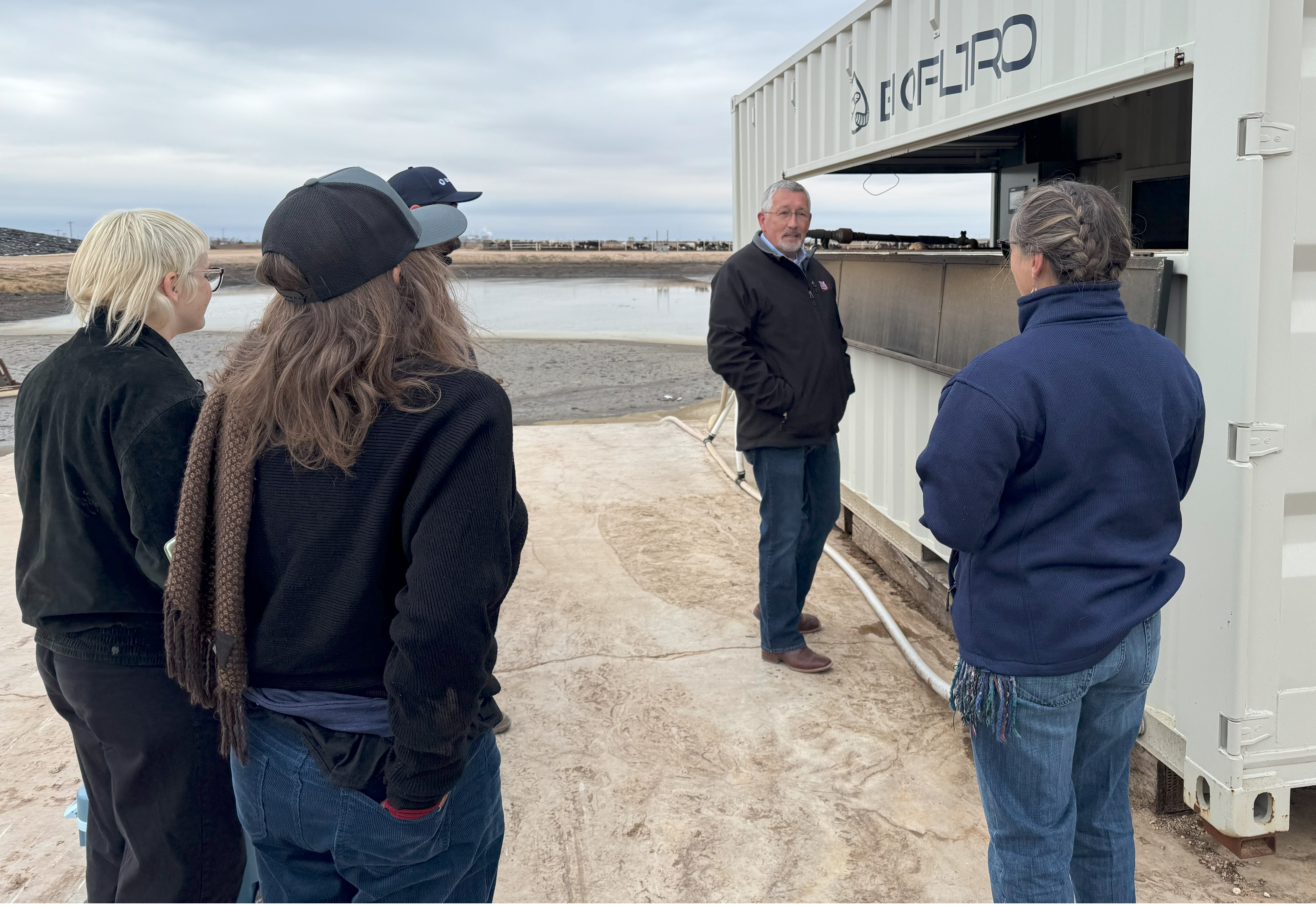 Event participants viewing vermifiltration system.